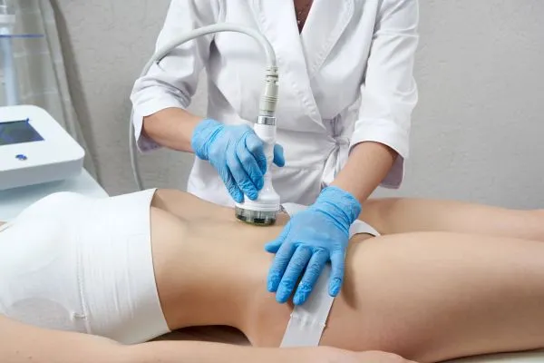 Lost the Weight but Not the Loose Skin? 2 woman having HIFU treatment on her stomach to combat loose skin Stamford following weight loss